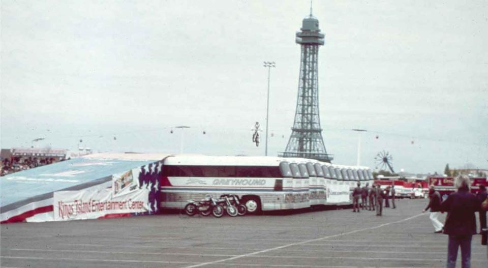 Daredevil Evel Knievel successfully jumped over 14 Greyhound buses on his motorcycle in the Kings Island parking lot on October 25, 1975. The jump was nationally televised and set a new world record. (Contributed Photo/ Kings Island PR)