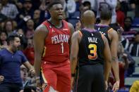 New Orleans Pelicans forward Zion Williamson (1) yells at Phoenix Suns guard Chris Paul (3) after a slam dunk in the first half of an NBA basketball game in New Orleans, Friday, Dec. 9, 2022. (AP Photo/Matthew Hinton)