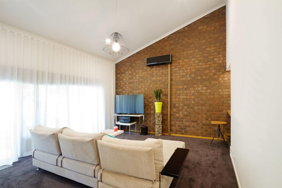 <p>Exposed brick was so popular in the '70s, you'd have thought everyone was bunking in an old warehouse. Add in an angled roofline and its twice the time trip back.</p>