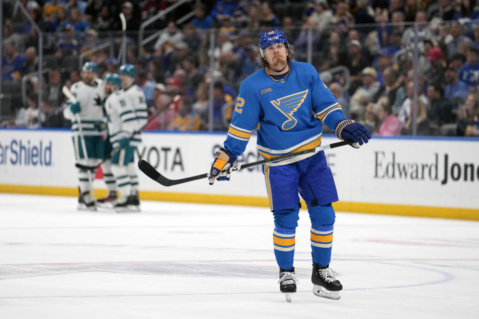 St. Louis Blues' Kasperi Kapanen, right, skates away as member of the San Jose Sharks celebrate a goal by teammate Luke Kunin during the second period of an NHL hockey game Saturday, March 30, 2024, in St. Louis. (AP Photo/Jeff Roberson)