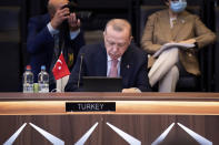 Turkey's President Recep Tayyip Erdogan attends a plenary session during a NATO summit at NATO headquarters in Brussels, Monday, June 14, 2021. U.S. President Joe Biden is taking part in his first NATO summit, where the 30-nation alliance hopes to reaffirm its unity and discuss increasingly tense relations with China and Russia, as the organization pulls its troops out after 18 years in Afghanistan. (Brendan Smialowski, Pool via AP)
