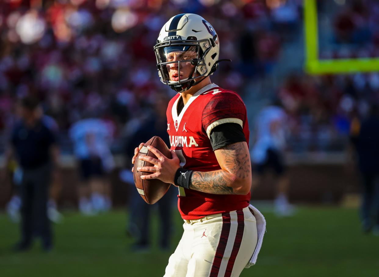 Sep 25, 2021; Norman, Oklahoma, USA; Oklahoma Sooners quarterback Spencer Rattler (7) throws before the game  against the West Virginia Mountaineers at Gaylord Family-Oklahoma Memorial Stadium.