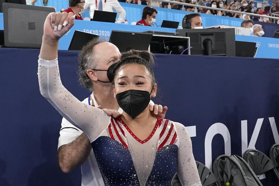 Sunisa Lee, of the United States, celebrates with her coach Jeff Graba after she won the gold medal in the artistic gymnastics women's all-around at the 2020 Summer Olympics, Thursday, July 29, 2021, in Tokyo. (AP Photo/Gregory Bull)