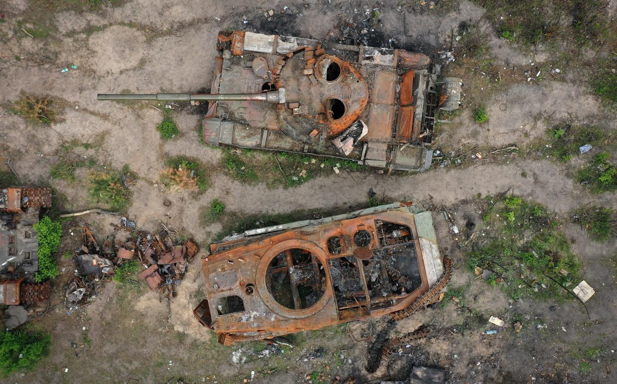 Destroyed Russian battle tanks and armoured vehicles beside a road in Irpin - Getty Images Europe