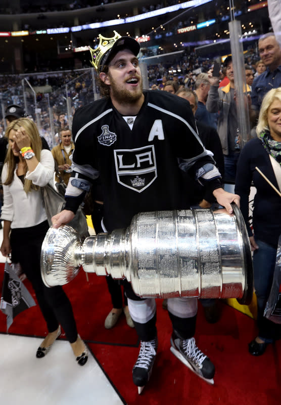 Dustin Brown holds up The Stanley Cup at an event where LA Kings News  Photo - Getty Images