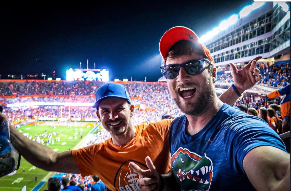 Ben Chase (right) included a stop at his alma mater, the University of Florida, as part of a road trip that took him to 77 college football games this season.