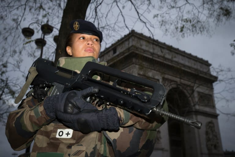 A French soldier patrols in front of the Arc de Triomphe in Paris after the November 2015 terror attacks