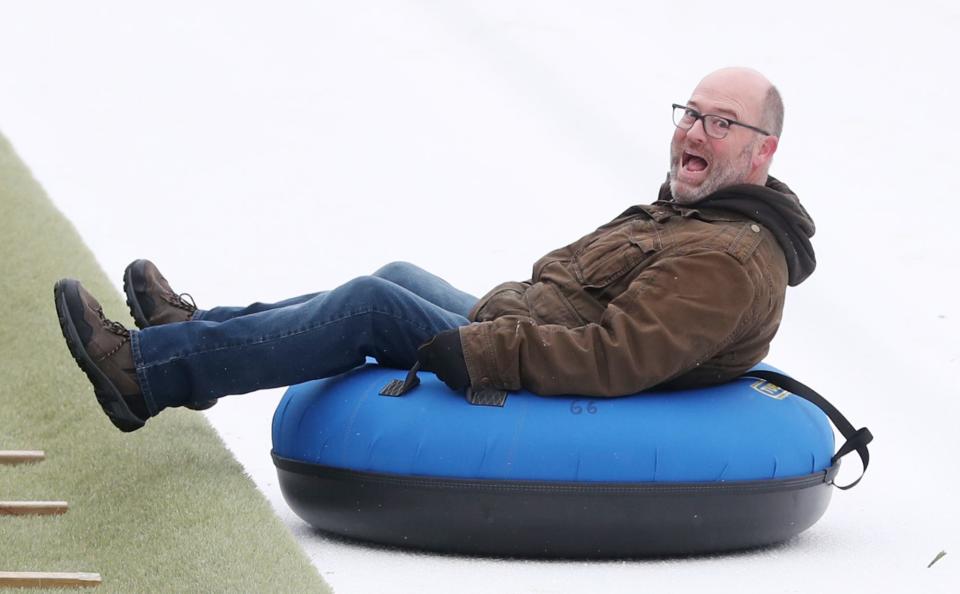 The Hall of Fame Village Winter Blitz Touchdown Tubing Hill that runs through the goal post and across the end zone of Tom Benson Hall of Fame Stadiums. The festival runs through January.