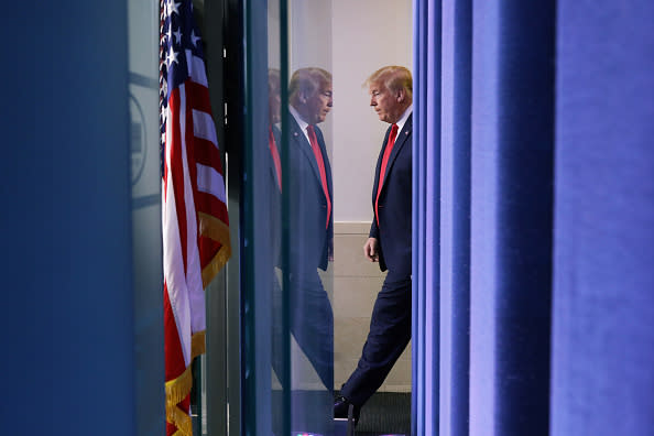 US President Donald Trump arrives to make a statement in the briefing room at the White House in Washington.