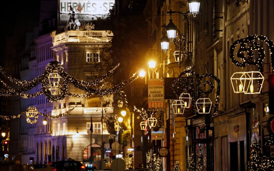 PARIS, FRANCE - NOVEMBER 22: Rue Saint-Honore is decorated with illuminations for Christmas and New Year celebrations on November 22, 2020 in Paris, France. Non-essential shops has been closed since October 30, when France imposed a national lockdown for a minimum four weeks as part of the Covid-19 measures to fight a second wave of coronavirus. (Photo by Chesnot/Getty Images) - Chesnot/Getty Images Europe