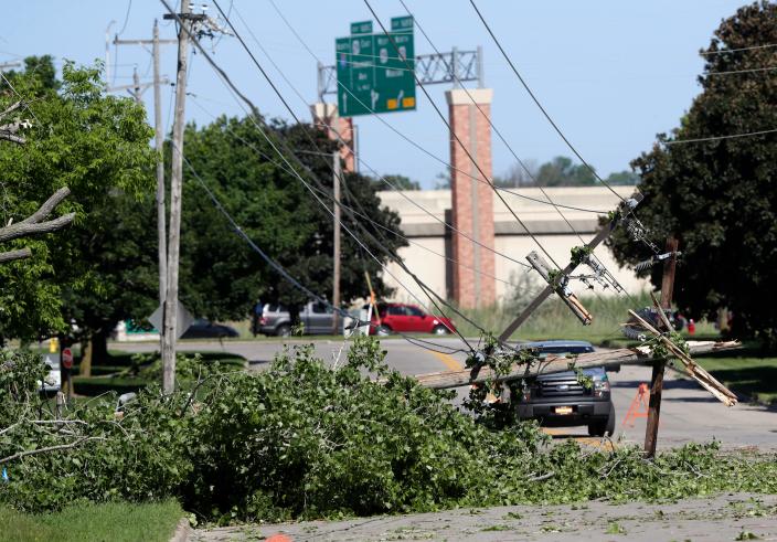 Power lines brought down by a tree on Larson Road in Green Bay after severe storms moved through the area Wednesday evening.