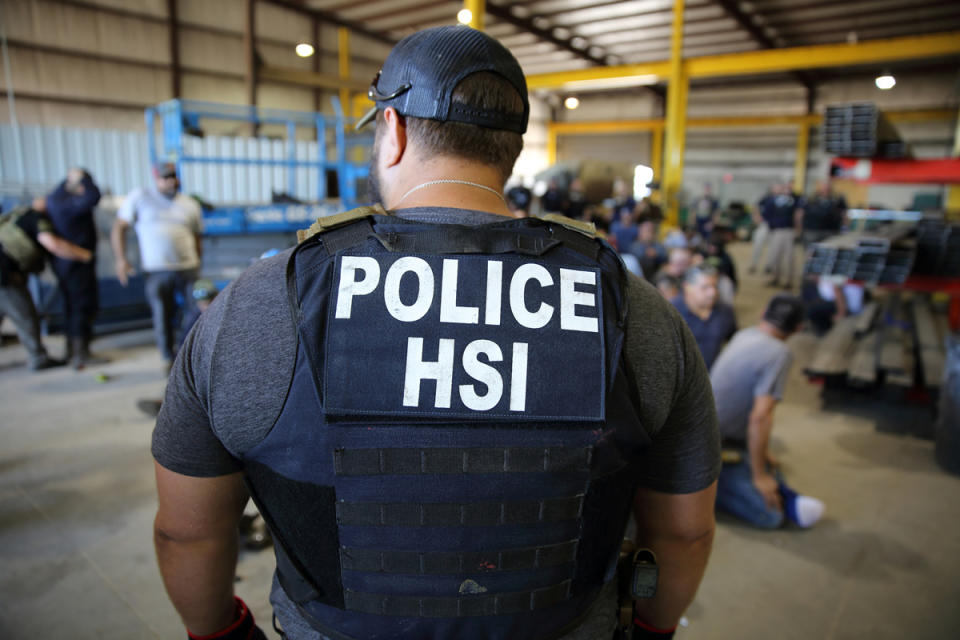 Homeland Security Investigations (HSI) officers arrest more than 100 employees on federal immigration violations at a trailer manufacturing business in Sumner, Texas, last year.