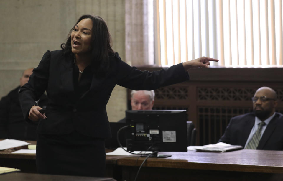 Assistant State's Attorney Risa Lanier gives her closing statement during closing statements in Shomari Legghette's, right, murder trial at the Leighton Criminal Courthouse, Friday, March 13, 2020, in Chicago. Legghette is on trial for first-degree murder in the Feb. 13, 2018, killing of Chicago Police Cmdr. Paul Bauer. (Antonio Perez/Chicago Tribune via AP)