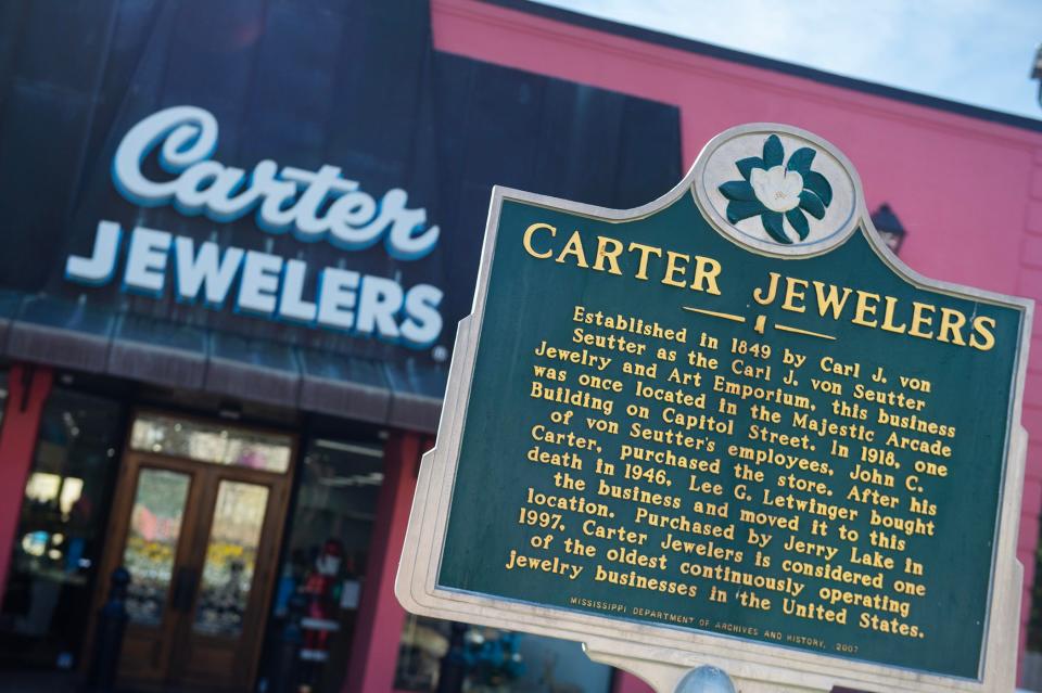 A historical marker sits in front of Carter Jewelry on Tuesday, Dec. 12, tracing the ownership of the jewelry store since it started in 1849. In its 174 years of existence, the jewelry store has only had four owners. It is one of the oldest continuously run jewelry stores in the United States.