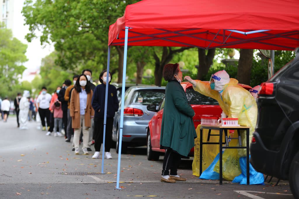 Residents queue up for COVID-19 nucleic acid tests at a gated community during the phased lockdown triggered by the COVID-19 outbreak in Shanghai, China on April 19, 2022.