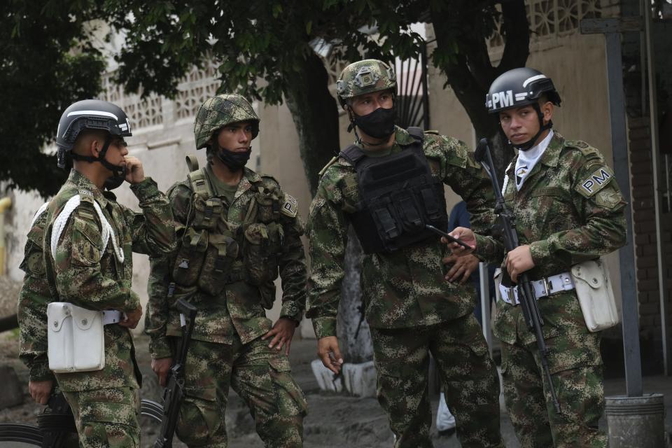 Soldiers stand guard near a military base where a car bomb exploded in Cucuta, Colombia, Tuesday, June 15, 2021. Colombian authorities still have not confirmed how many were injured in the explosion. (AP Photo/Ferley Ospina)