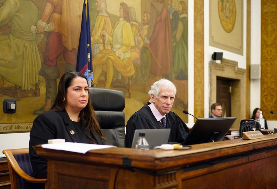 Judge Arthur Engoron sits three feet to the left of his principal law clerk, Allison Greenfield, at the Trump fraud trial in New York.