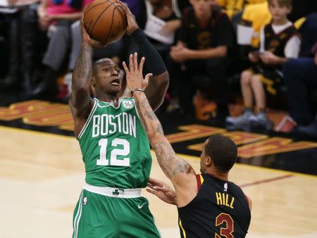 May 19, 2018; Cleveland, OH, USA; Cleveland Cavaliers guard George Hill (3) defends Boston Celtics guard Terry Rozier (12) during the first quarter in game three of the Eastern conference finals of the 2018 NBA Playoffs at Quicken Loans Arena. Mandatory Credit: Aaron Doster-USA TODAY Sports