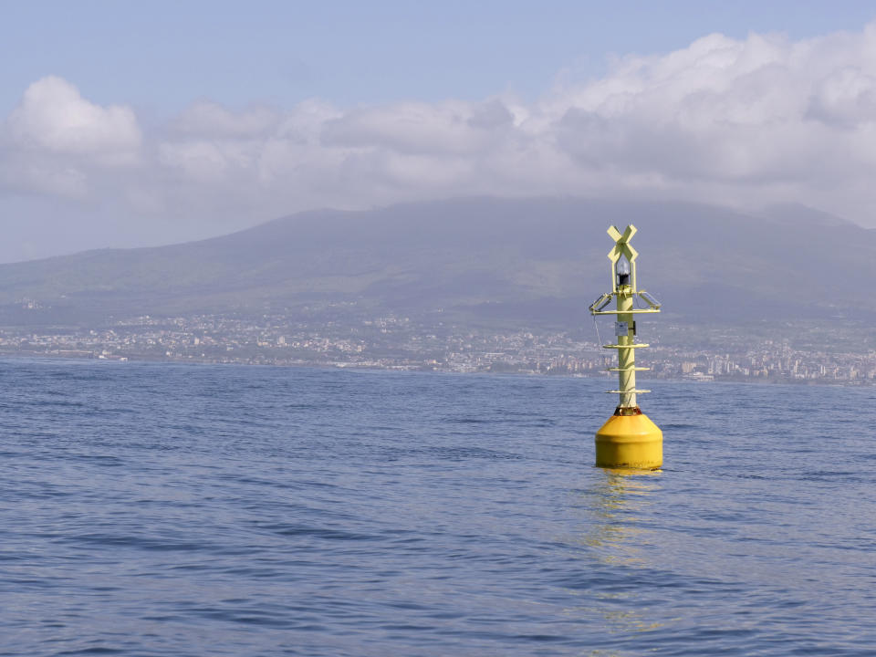 In this photo taken on Sunday May 3, 2020, a buoy floats in the Gulf of Naples, Italy. Preliminary results from a survey of seawater quality during Italy’s coronavirus lockdown indicate a sharp reduction in pollution from human and livestock waste in the seas off Rome. Authorities stressed it was too soon to give the lockdown sole credit for the change. They say shifting sea currents and limited rainfall in April and May also could have reduced runoff from agriculture. (AP Photo/Paolo Santalucia)