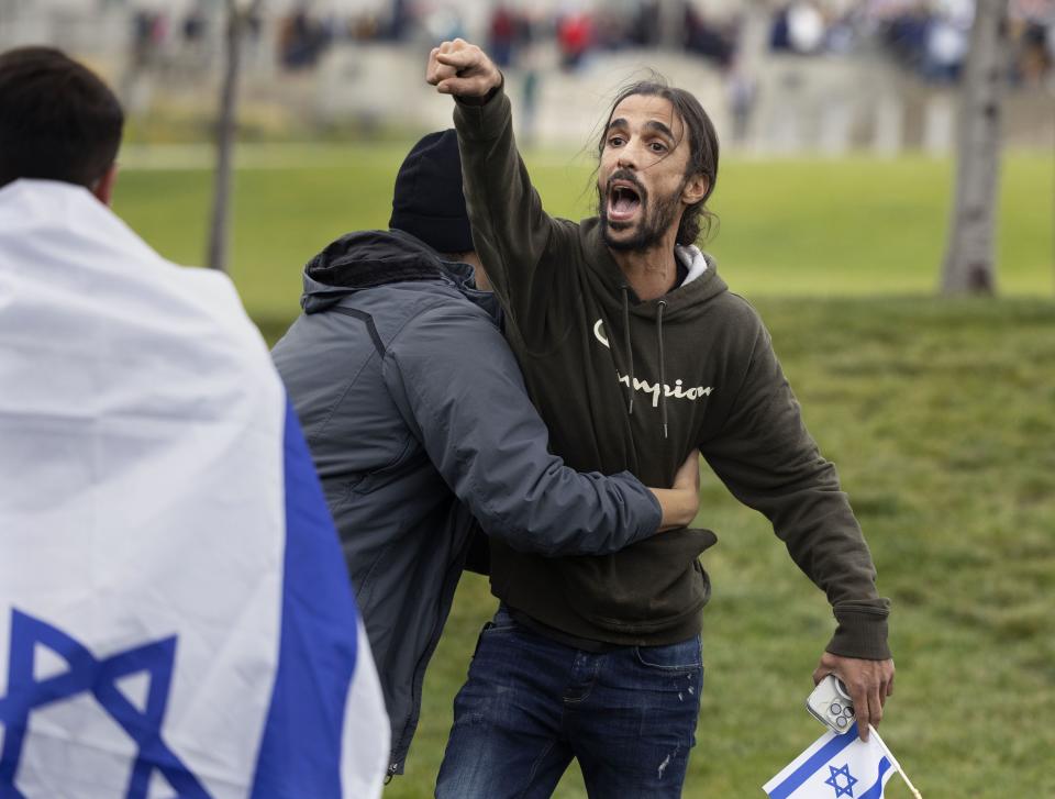 An attendee of the Stand with Israel rally is restrained from a protester at the Capitol in Salt Lake City on Wednesday, Oct. 11, 2023. | Laura Seitz, Deseret News