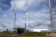 A SpaceX Falcon 9 rocket stands atop its launch pad during preflight preparations to loft a private Dragon space capsule on the first commercial cargo flight to the International Space Station. Liftoff is set for Oct. 7, 2012, at 8:35 p.m. ET f