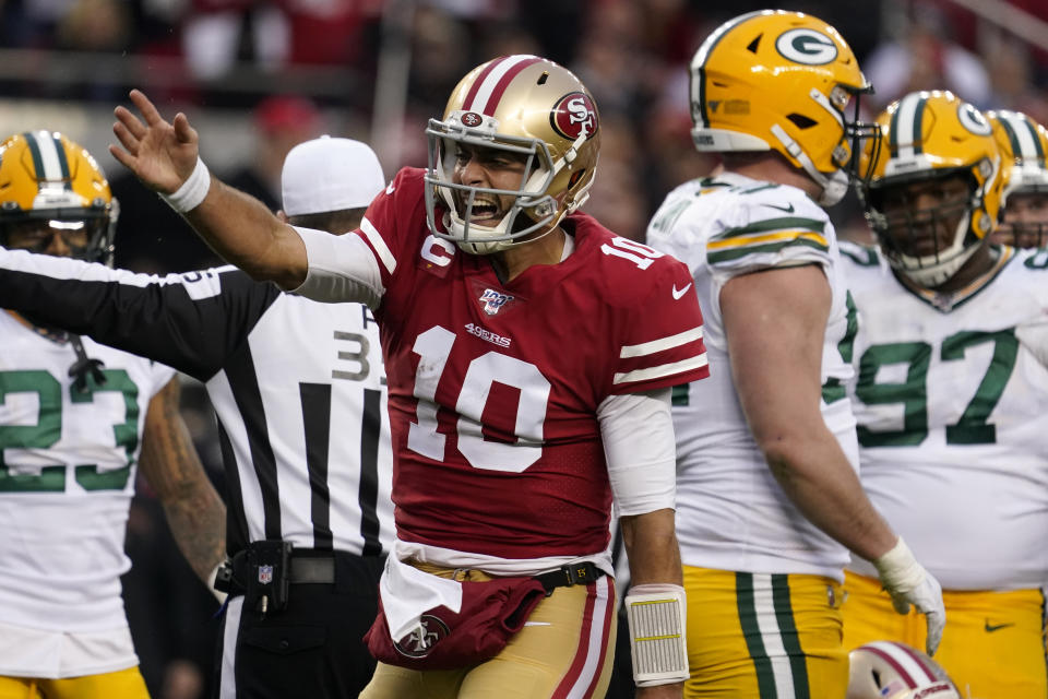 San Francisco 49ers quarterback Jimmy Garoppolo (10) celebrates after converting a first down against the Green Bay Packers during the first half of the NFL NFC Championship football game Sunday, Jan. 19, 2020, in Santa Clara, Calif. (AP Photo/Tony Avelar)