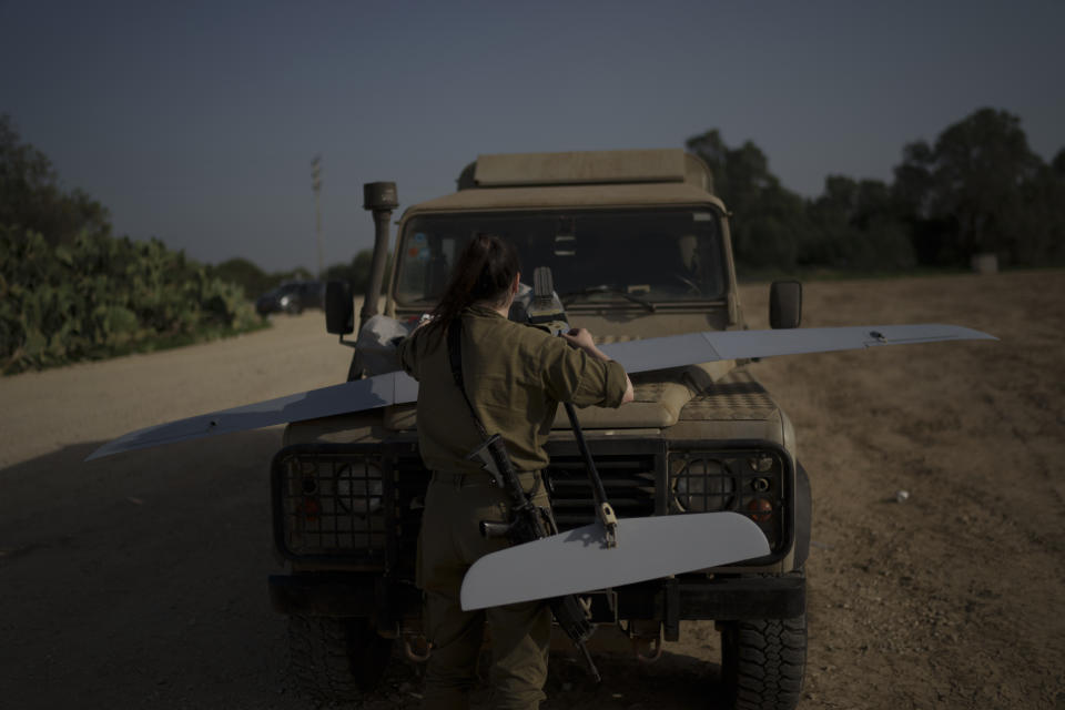 An Israeli soldier prepares a drone to be launched near the Israeli-Gaza border, southern Israel, Tuesday, Jan. 9, 2024. (AP Photo/Leo Correa)