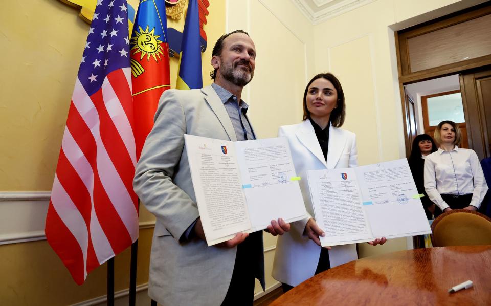 Bruce Roberts, founder and CEO of August Mission, poses for photos with Violetta Labazuik, head of the Khmelnytskyi Regional Council, following a meeting with government officials and members of the Utah delegation in Khmelnytskyi, Oblast Ukraine, on Monday, May 1, 2023. | Scott G Winterton, Deseret News