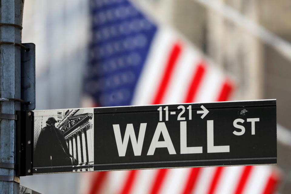 Stocks: A street sign for Wall Street is seen outside the New York Stock Exchange (NYSE)