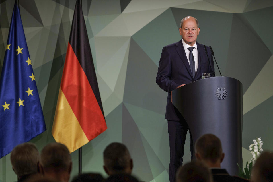 German Chancellor Olaf Scholz (SPD) speaks at the 2022 Bundeswehr Conference in Berlin, Friday, Sept. 16, 2022. Germany is taking control of three Russian-owned refineries in the country to ensure energy security before an embargo on oil from Russia takes effect next year. The Economy Ministry said in a statement Friday that Rosneft Deutschland GmbH and RN Refining & Marketing GmbH will be put under the administration of Germany’s Federal Network Agency. (Carsten Koall/dpa via AP)