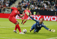 Peru's Jefferson Frafan, left, misses too score against German goal keeper Marc Andree per Steven during a friendly soccer match between Germany and Peru in Sinsheim, Germany, Sunday, Sept. 9, 2018. (AP Photo/Michael Probst)