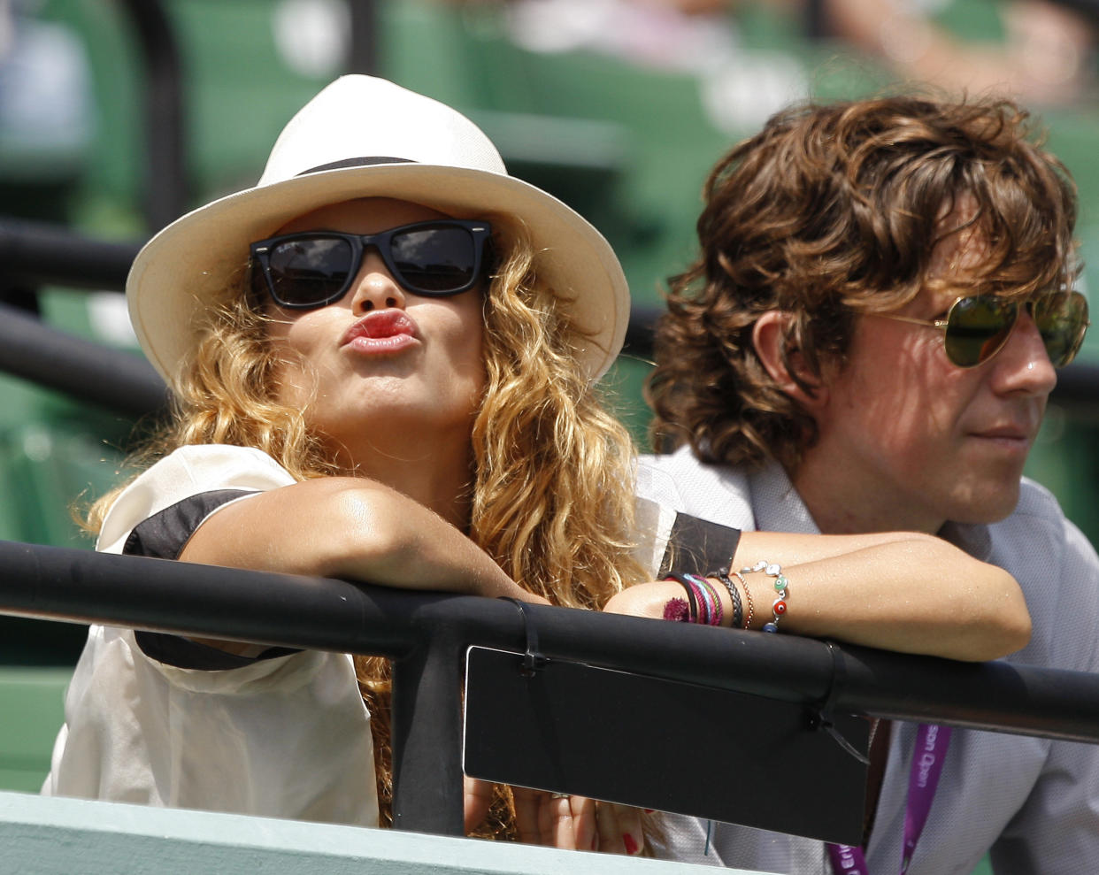 Mexican singer and actress Paulina Rubio (L) blows a kiss as she watches a semifinal match between Rafael Nadal of Spain and Tomas Berdych of Czech Republic at the Sony Ericsson Open tennis tournament in Key Biscayne, Florida April 4, 2008.  REUTERS/Carlos Barria  (UNITED STATES)