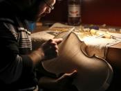 Mario Capelli, a violinmaker, works on a violin at Trabucchi's workshop in Cremona, Italy, March 11, 2016.REUTERS/Stefano Rellandini