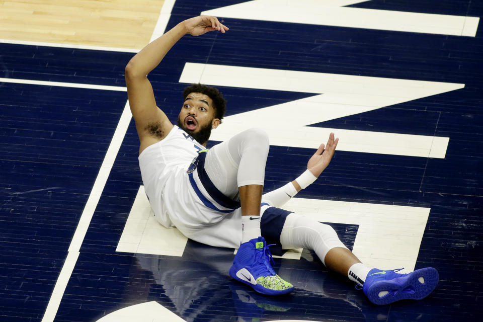 Minnesota Timberwolves center Karl-Anthony Towns (32) reacts to a foul call against the Chicago Bulls in the second quarter during an NBA basketball game, Sunday, April 11, 2021, in Minneapolis. (AP Photo/Andy Clayton-King)