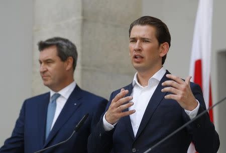 Bavaria's Prime Minister Markus Soeder and Austria's Chancellor Sebastian Kurz address a news conference after a joint Austrian and Bavarian cabinet meeting in Linz, Austria, June 20, 2018. REUTERS/Leonhard Foeger