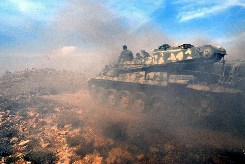 In this photo released on Sunday, April 13, 2014 by the Syrian official news agency SANA, a Syrian forces tank arrives to take position during clashes with Syrian rebels, near the town of Rankous, Syria. The seizure of the villages comes a day after Syrian troops backed by fighters from Lebanon's Shiite militant Hezbollah group captured the nearby town of Rankous. (AP Photo/SANA)