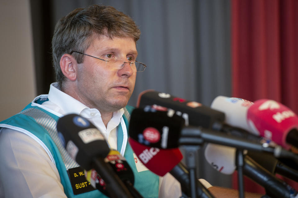 Daniel Knecht, of the Swiss Transportation Safety Investigation Board (STSB), addresses the media during a press conference in Flims, Switzerland, Sunday, Aug. 5, 2018 about the plane crash on Saturday afternoon. The plane, a Junkers Ju-52, crashed on Saturday, Aug. 4, 2018 at the Piz Segnas, all 20 people aboard died. (Melanie Duchene/Keystone via AP)