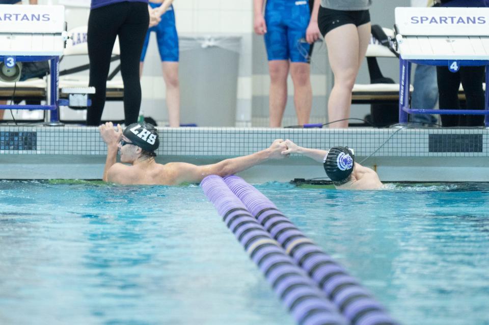 Lakeview swimmers Brayden Mentzer and Cody Richard congratulate each other after the 200 yard individual medley race during the All-City swim and dive meet at Lakeview High School on Saturday, Jan. 20, 2023.