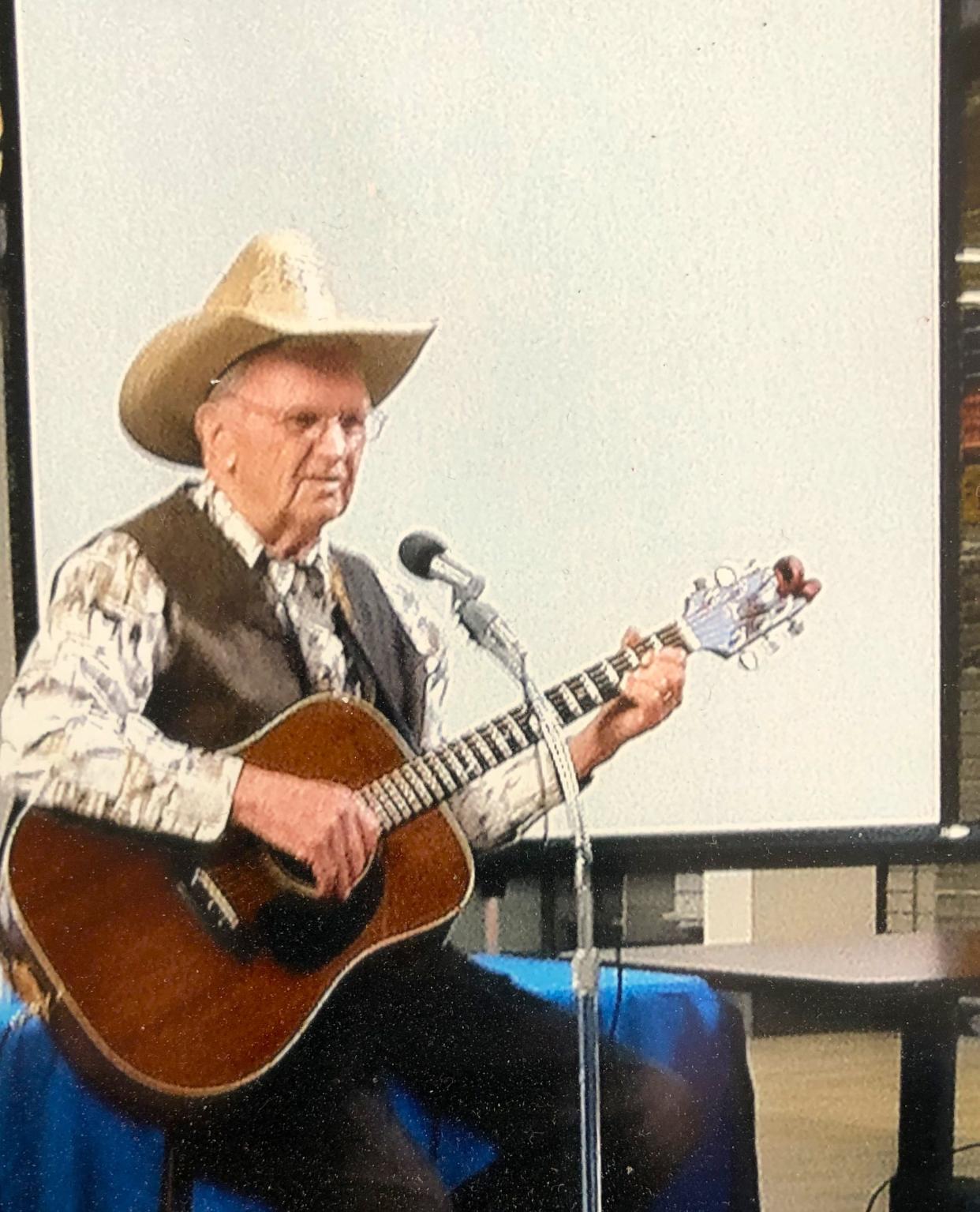 Tom Grono plays the guitar at the Hanover Mall in the 1980s for the fitness walkers. He had an hourlong show of country songs.