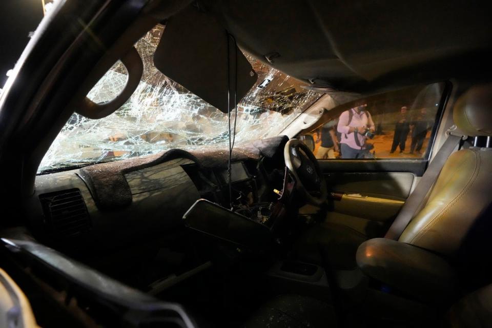 A damaged car is seen at the site of an explosion that caused injuries and destroyed vehicles outside the airport in Karachi, Pakistan, Monday, Oct. 7, 2024. (Copyright 2024 The Associated Press. All rights reserved.)