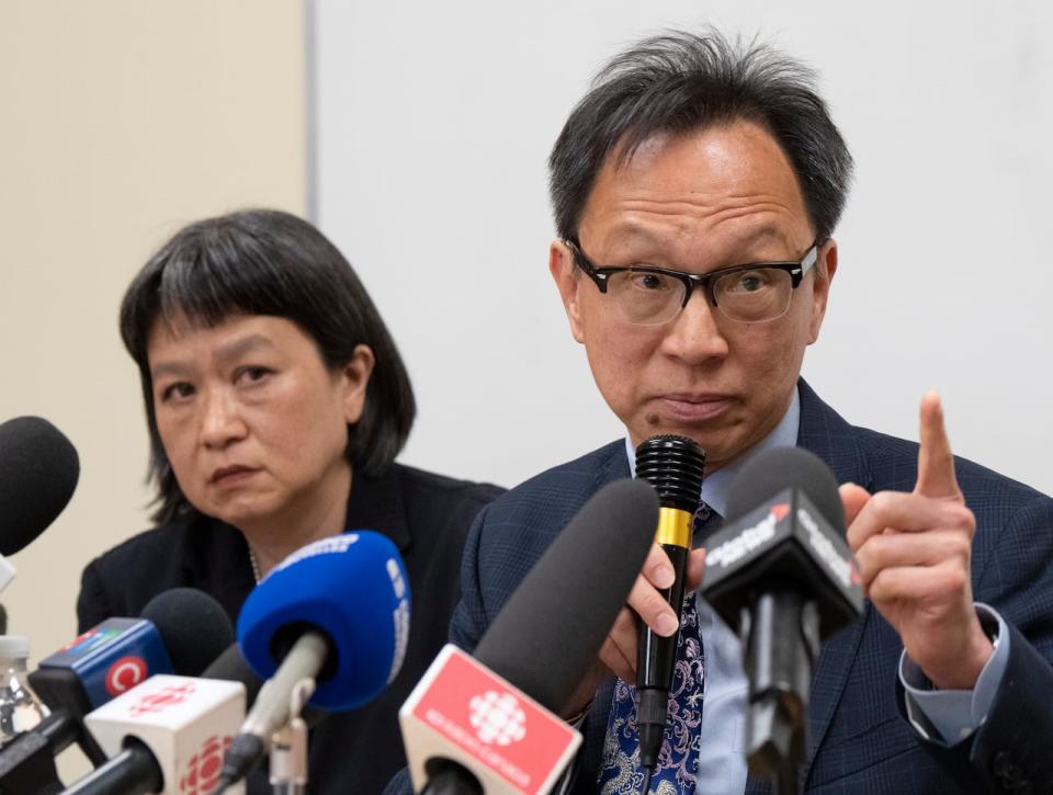 Sen. Yuen Pau Woo denounces RCMP allegations of Chinese government interference in Canada as community organizer May Chiu looks on during a news conference at the Chinese Family Service center, May 5, 2023 in Montreal. 