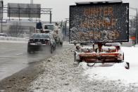 Travelers make their way into the city on I-395 in Washington, Monday, March 17, 2014, after a winter snow storm. (AP Photo/Alex Brandon)