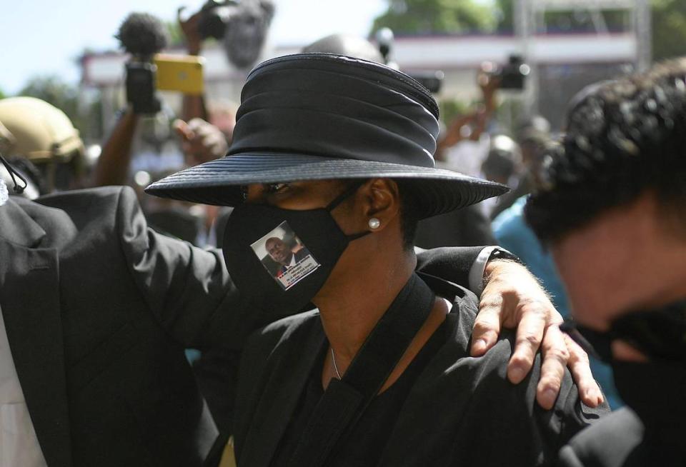Martine Moïse attends the funeral of her slain husband, President Jovenel Moïse, at his family home in Haiti, Friday, July 23, 2021. The first lady was wounded in the July 7 attack at their private home and returned to Haiti following her release from a Miami hospital.