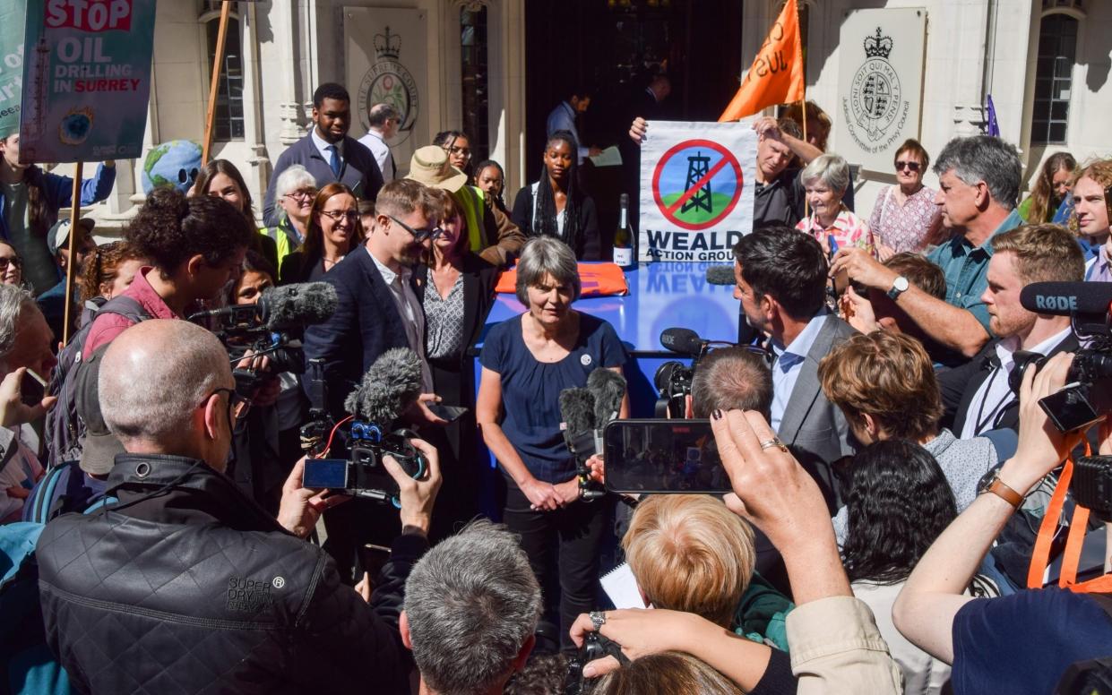 Campaigner Sarah Finch speaks to reporters in June after the Supreme Court ruled that Surrey County Council acted unlawfully in allowing planning permission for oil production without considering its climate impacts