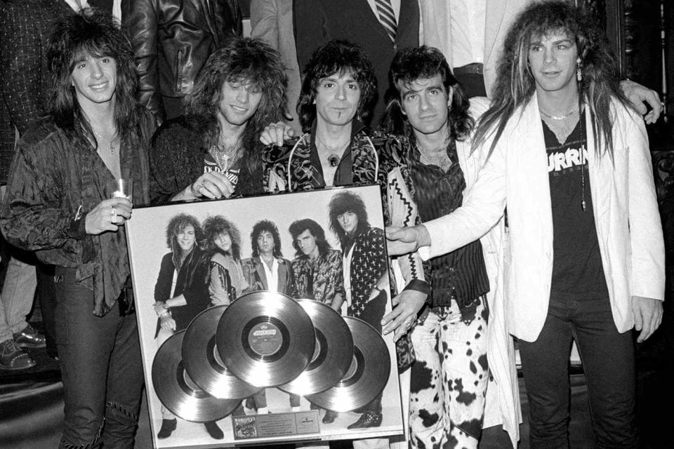 <p>Lester Cohen/Getty</p> (L-R) Richie Sambora, Jon Bon Jovi,  Alec John Such, Tico Torres, David Bryan ca. 1986