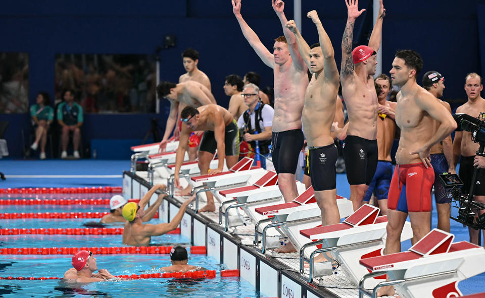 Great Britain celebrate after winning the men's 4x200m relay at the Olympics.