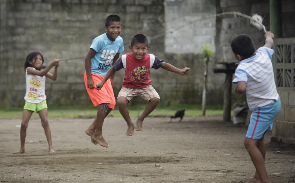 In this Sept. 21, 2019 photo, children jump rope in Jaque, Panama. Jaque is a fishing village and some locals also sell handicrafts, including plates made from palm fronds decorated with drawings of sea turtles. (AP Photo/Arnulfo Franco)