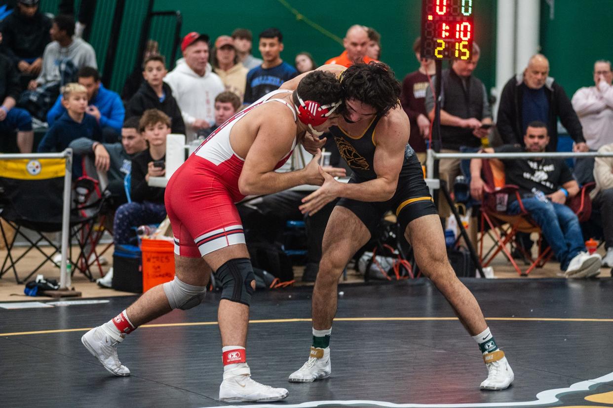 Fox Lane's Alex Berisha, left, wrestles McQuaid-Jesuit's Harrison Aguirre in the 215 pound weight class during Eastern State Classics at SUNY Sullivan in Loch Sheldrake, NY on Saturday, January 13. 2024.