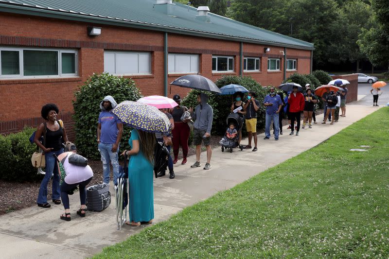 FILE PHOTO: Voters line up to cast their ballots in Atlanta