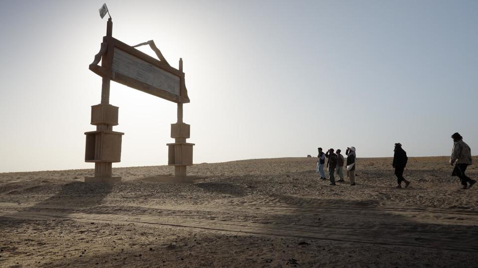 The stone-gate memorial marking the massacre at Dasht-e-Leili